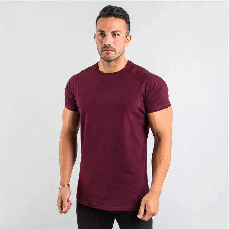 T-shirt de sport à manches raglan et col rond pour homme